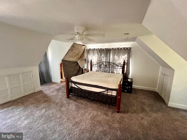 carpeted bedroom featuring ceiling fan, baseboards, and lofted ceiling