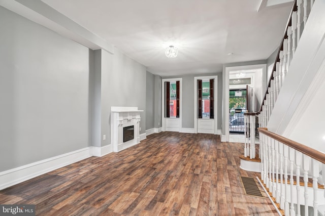 unfurnished living room with hardwood / wood-style floors