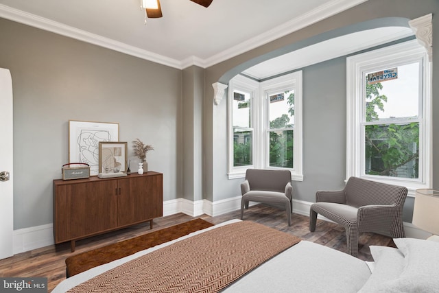 bedroom with hardwood / wood-style flooring, ceiling fan, ornamental molding, and multiple windows