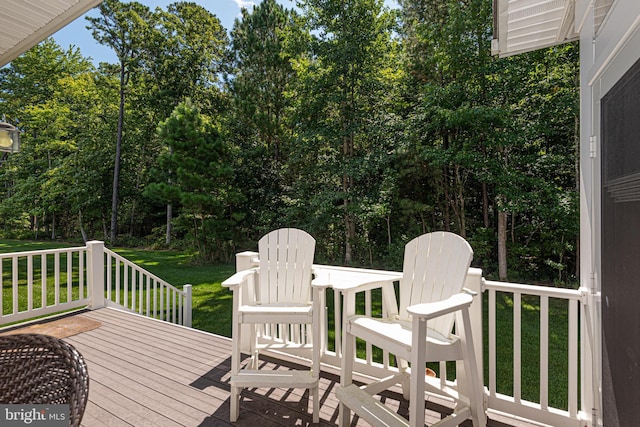 wooden deck with a yard