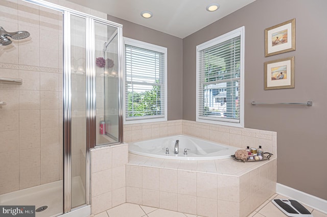 full bathroom with baseboards, tile patterned floors, a shower stall, a bath, and recessed lighting