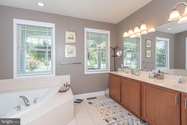 full bathroom featuring tile patterned flooring, a healthy amount of sunlight, a garden tub, and double vanity