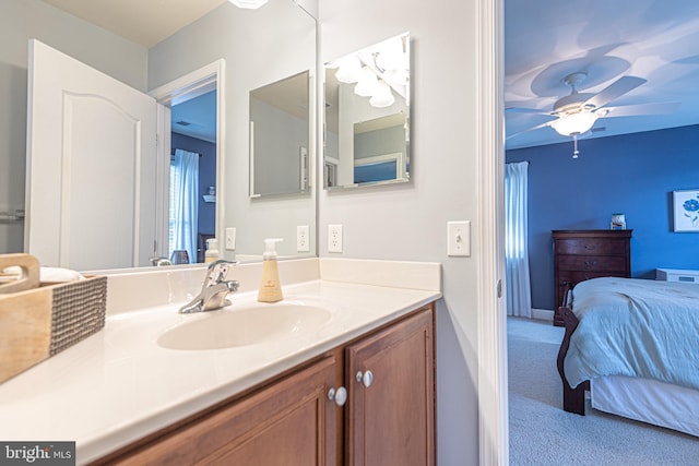 ensuite bathroom with vanity, a ceiling fan, and ensuite bathroom