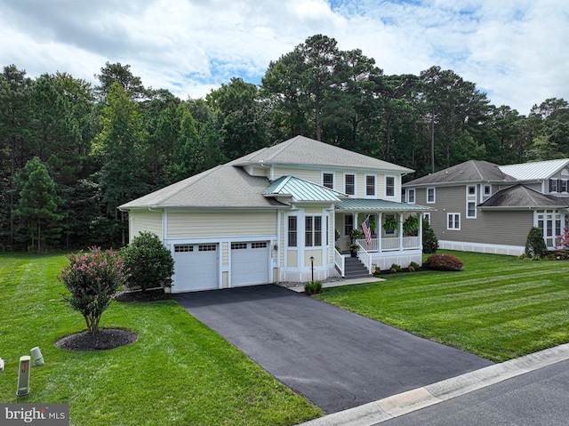 view of front facade with a shingled roof, a porch, aphalt driveway, an attached garage, and a front lawn