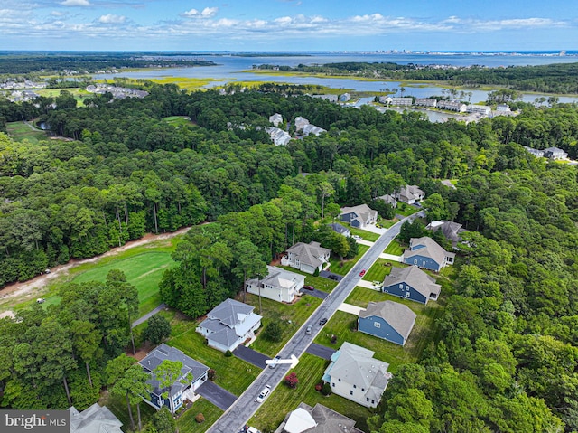 birds eye view of property with a water view and a residential view