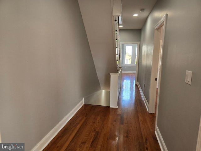 corridor featuring dark wood-type flooring