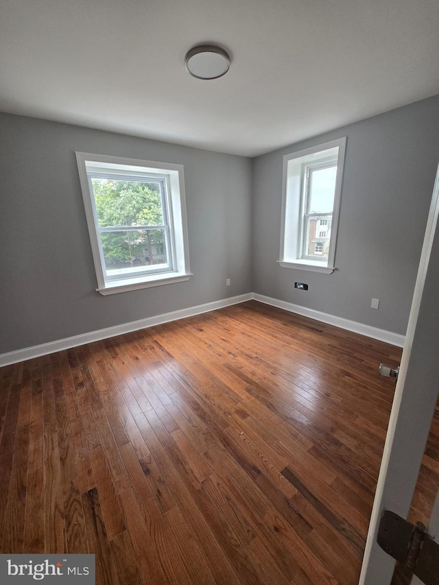 empty room with wood-type flooring