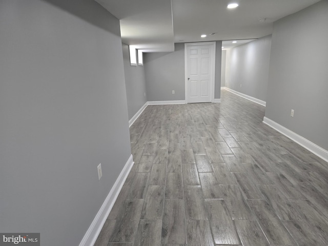 basement with hardwood / wood-style floors