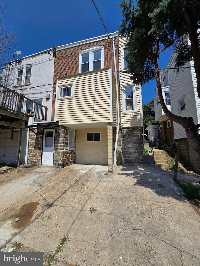 multi unit property featuring a garage