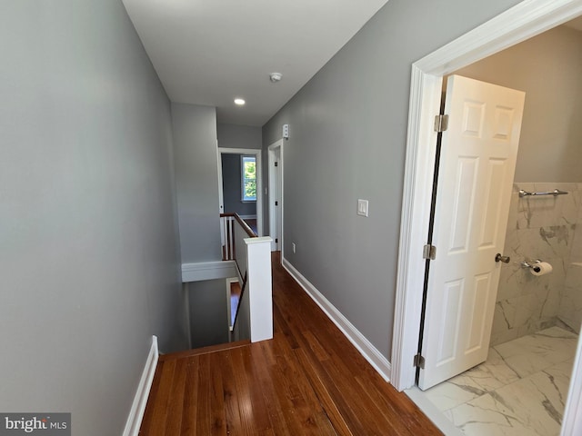 corridor with light wood-type flooring