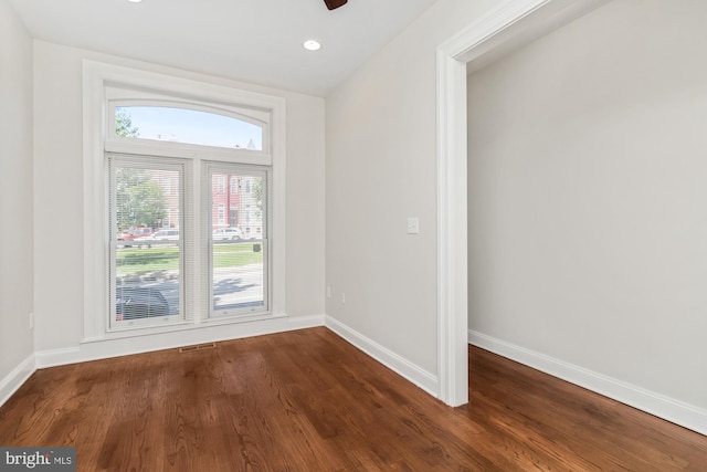 empty room with hardwood / wood-style floors