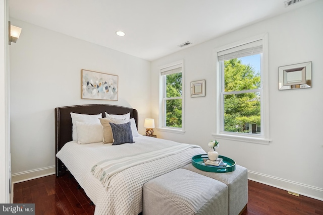 bedroom featuring dark hardwood / wood-style flooring