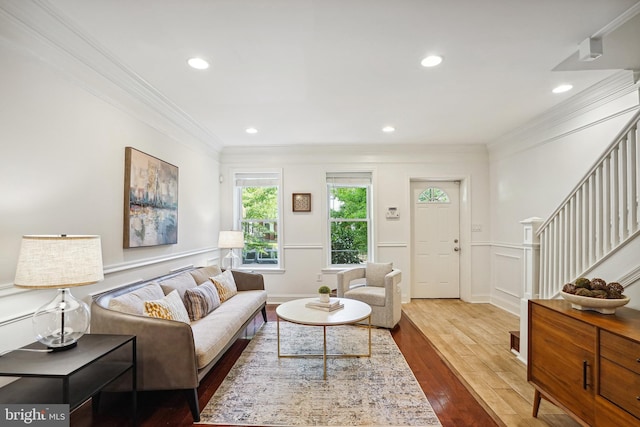 living room featuring ornamental molding and hardwood / wood-style floors