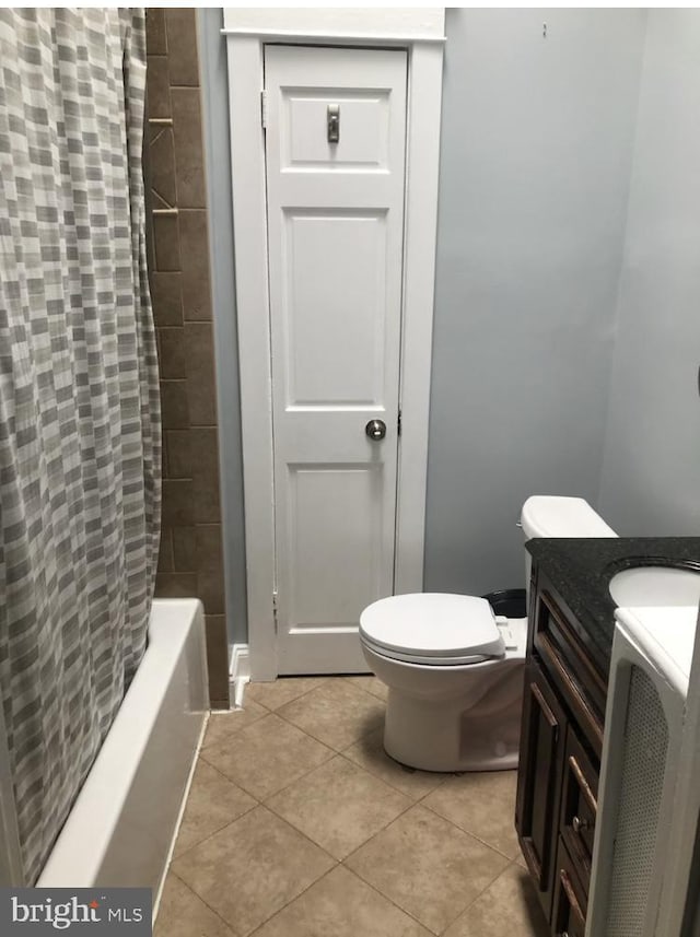 full bathroom with vanity, tile patterned flooring, toilet, and shower / bath combo