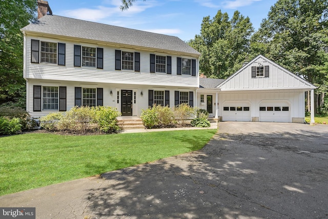 colonial home with a front lawn