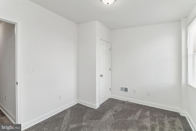 unfurnished room with carpet floors