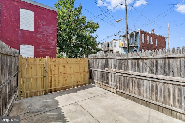 view of patio / terrace featuring fence