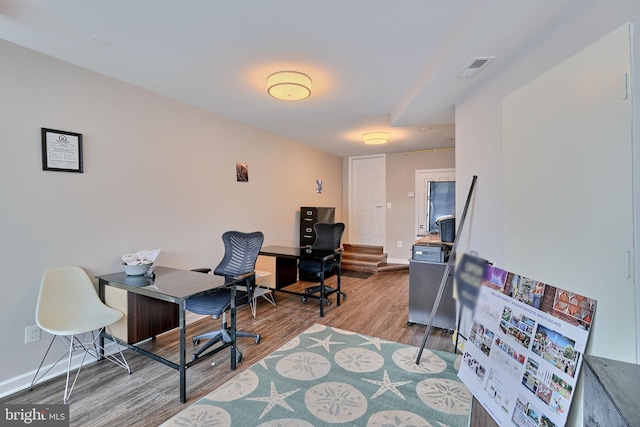 office area with light hardwood / wood-style floors