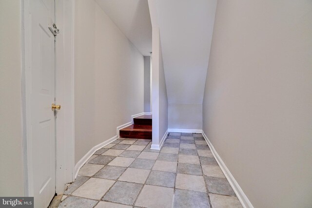 stairway with tile patterned flooring