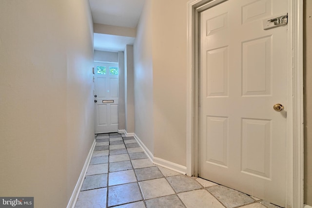 corridor with light tile patterned flooring