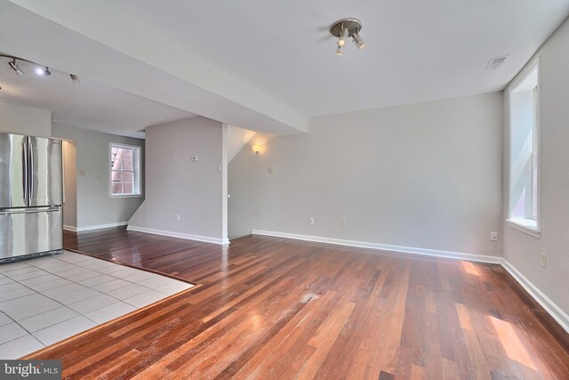 unfurnished living room featuring hardwood / wood-style floors