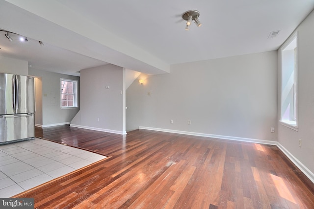 unfurnished living room featuring light wood-type flooring