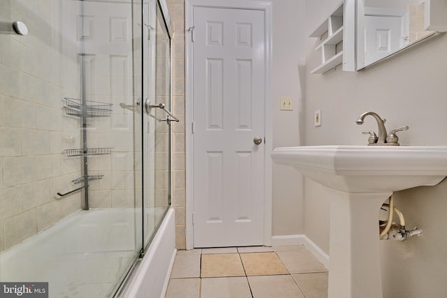 bathroom featuring enclosed tub / shower combo and tile patterned floors