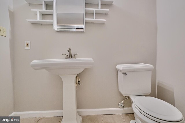 bathroom featuring tile patterned floors and toilet