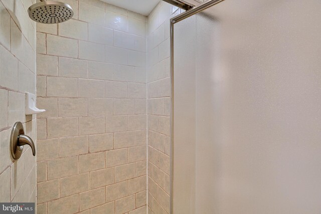 interior space with a tile shower