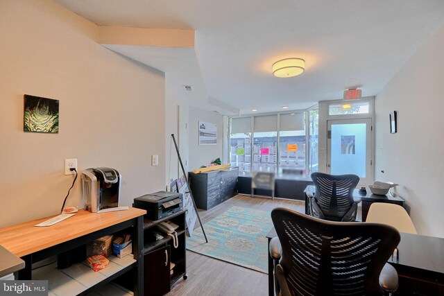 interior space featuring floor to ceiling windows and wood-type flooring