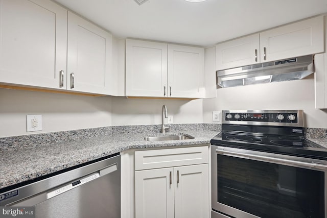 kitchen featuring stainless steel appliances, white cabinetry, and sink