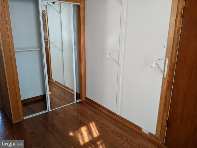 unfurnished bedroom featuring dark hardwood / wood-style floors