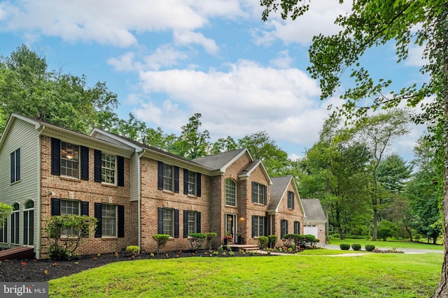 colonial-style house with a front lawn