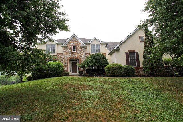 view of front of house with a front lawn