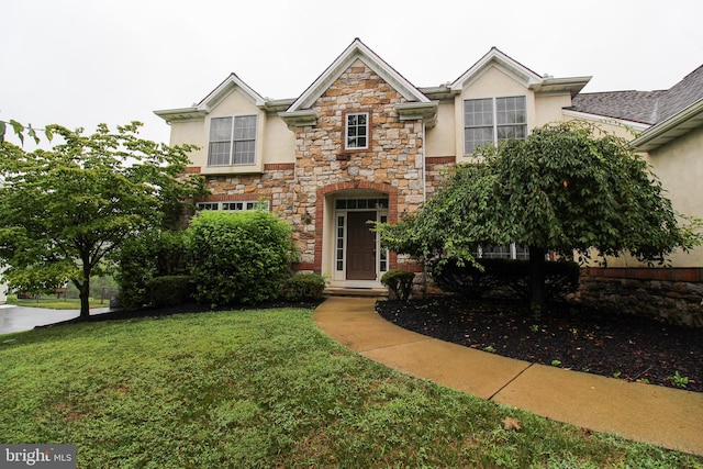 view of front of home featuring a front yard