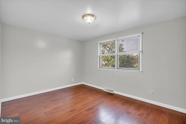 spare room featuring hardwood / wood-style flooring