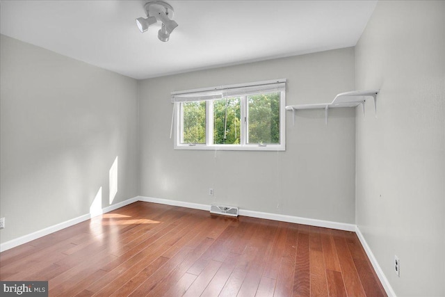 unfurnished room featuring wood-type flooring