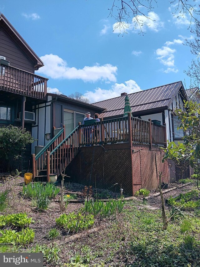 view of property exterior with a deck