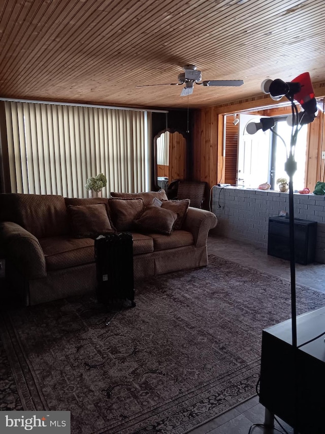 living room with wood ceiling and ceiling fan