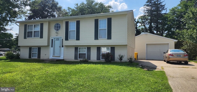 raised ranch with an outbuilding, a garage, and a front yard