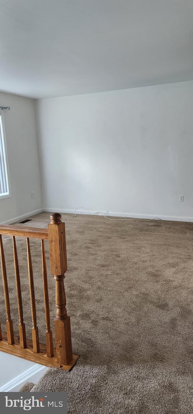 unfurnished room with carpet floors