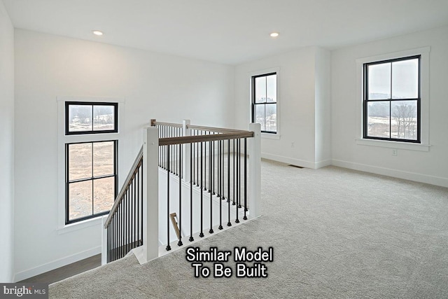 hallway featuring carpet flooring