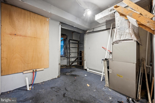 basement featuring a baseboard heating unit