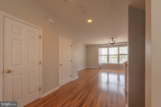 unfurnished room with wood-type flooring