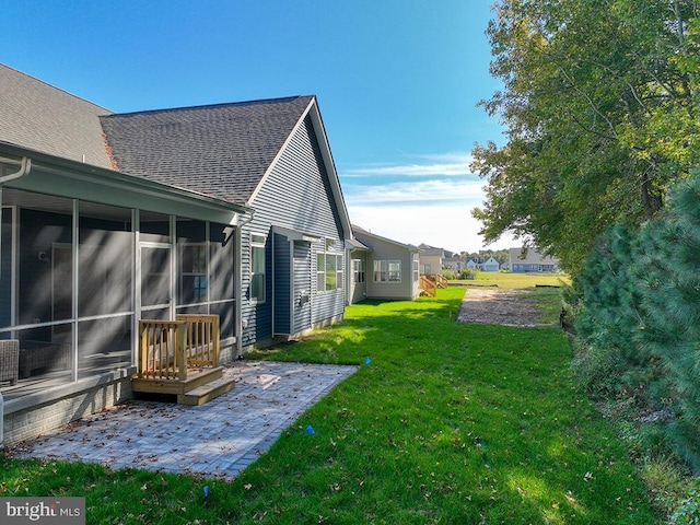 14274 Schooner Run Unit 83, Ellendale, DE 19941 - view of grassy yard with a patio area and a sunroom