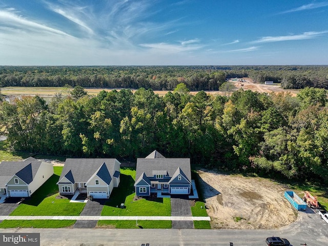14274 Schooner Run Unit 83, Ellendale, DE 19941 - aerial view of property and surrounding area featuring a forest