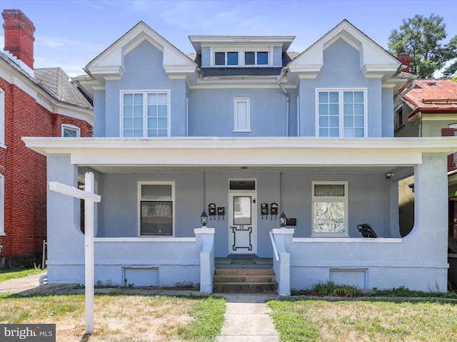 view of front of home featuring covered porch