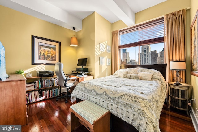 bedroom with dark hardwood / wood-style flooring