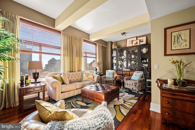 living area with dark hardwood / wood-style floors and beam ceiling