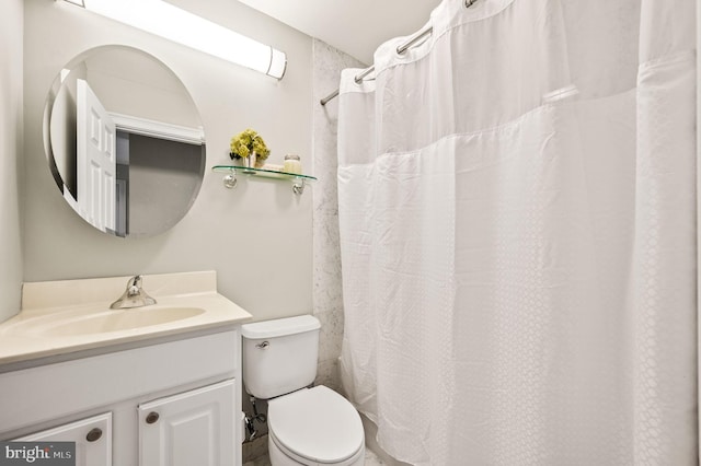 bathroom with toilet, walk in shower, and vanity